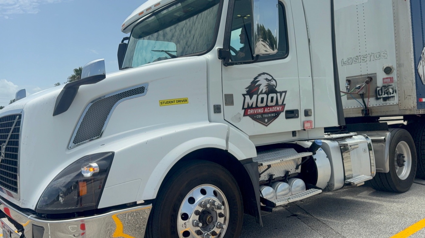 Moov Driving Academy training truck with the Moov logo